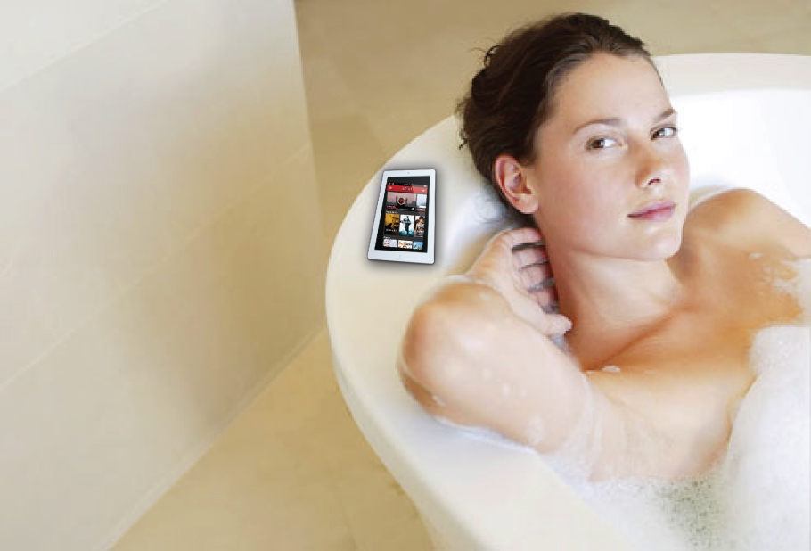 woman texting in the bathtub